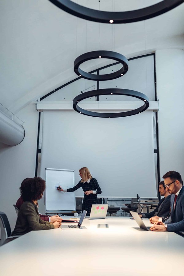 How does the implementation of community energy systems impact property values in new developments?